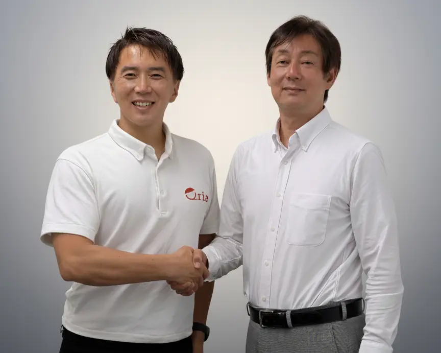 株式会社キュリエ 代表取締役社長 吉塚康一(左)とエステーイメージング株式会社 代表取締役社長 田口哲也(右)